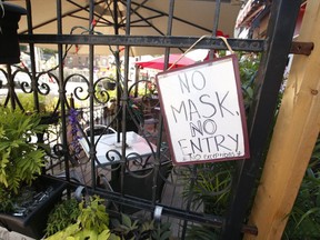 Vi Vetha restaurant in Toronto reminds patrons about COVID and the wearing of masks.