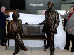 A file photo of the bench with statues of Sir John A. Macdonald and Sir Georges-Etienne Cartier at the Ottawa International Airport.