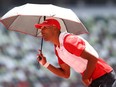 Canadian Damian Warner, who leads the decathlon after the first day’s five events, said the ice-packed cooling vests he and many outdoor athletes have been wearing have been “a life-saver.”