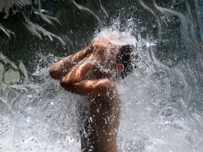 FILE: A young boy cools down.