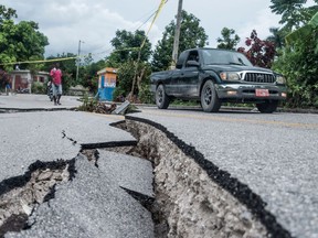 The severely damaged road to Camp-Perrin leading to Jeremie, is viewed after the earthquake near Camp-Perrin, Haiti on August 16, 2021. -
