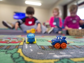FILE: Children play at a daycare.