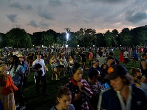 People exit the field as severe weather approaches the area after the cancellation of the "We Love NYC: The Homecoming Concert" at Central Park in New York City, New York, U.S., August 21, 2021.