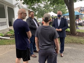 Conservative leader Erin O'Toole and Nepean riding candidate Matt Triemstra, second from left, talk to potential voters at a campaign event in Nepean on Thursday.