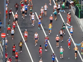General view of the athletes warming up before the Men's Marathon at the Tokyo 2020 Olympics, Aug. 8, 2021.