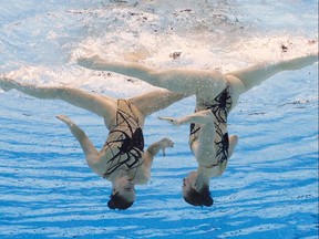 Svetlana Kolesnichenko  and Svetlana Romashina of the Russian Olympic Committee during their performance in Artistic Swimming - Women's Duet Free at the Tokyo 2020 Olympics, August 4, 2021.