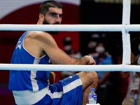 France's Mourad Aliev reacts after losing by disqualification against Britain's Frazer Clarke during their men's super heavy (over 91kg) quarter-final boxing match during the Tokyo 2020 Olympic Games.