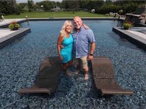 Keri Oakley and David Boudreau in their new pool outside their Manotick-area home Friday.