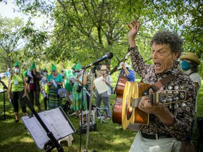 A large group gathered in the Experimental Farm on Sunday to sing in protest against the removal of mature trees to make way for buildings and parking for the new Civic campus of The Ottawa Hospital. Chris White led some of the songs on Sunday afternoon.