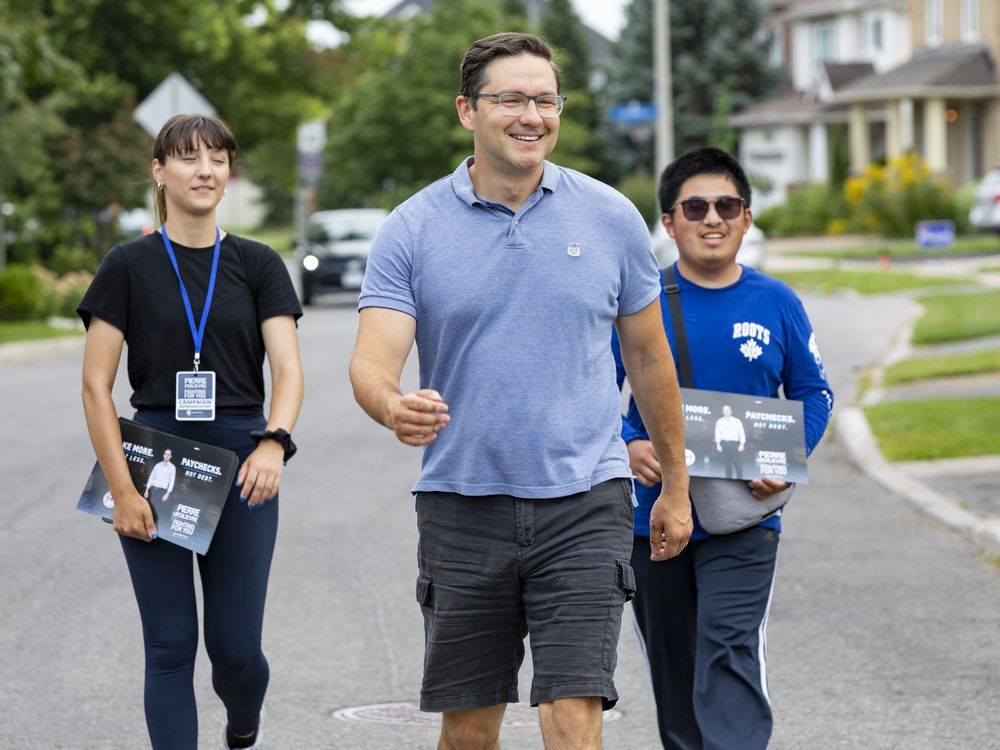  Pierre Poilievre goes door to door in his Carleton riding with campaign workers. PHOTO BY ERROL MCGIHON/ Postmedia