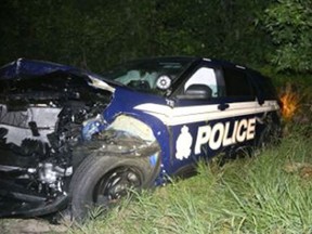 A smashed Ottawa Police cruiser after being hit in a head-on collision near Joys Rd and Franktown Rd.