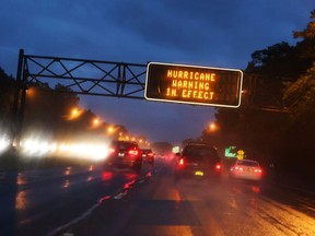 Signs on the highway warn commuters not to travel on Sunday as Hurricane Henri approaches in Long Island, New York, U.S., August 21, 2021.