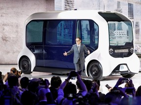 FILE PHOTO: Toyota Motor Corporation President Akio Toyoda, shows the e-Palette autonomous concept vehicle   at the Tokyo Motor Show, in Tokyo, Japan October 23, 2019.