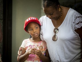 A group came together in front of the Haitian Embassy on Albert Street on Sunday, Aug. 22, 2021, to show support for the community while collecting items to be shipped to Haiti to help with aid after a devastating earthquake. Marie-Yvonne Cleaver was there with her granddaughter, seven-year-old Akira Simonise.