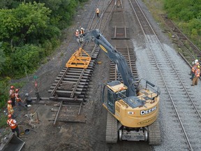 Crews replace a section of CN Rail track just east of the Edward Street overpass in Prescott on Friday afternoon.