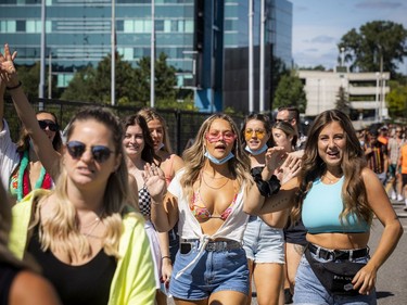 Young festival goers make their way to the entrance for Escapade Music Festival that was held at the RCGT Park, Saturday, Sept. 4, 2021.