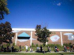 Long lines stretched around the building, mostly parents with children, at the COVID-19 testing clinic that opened at McNabb Arena, September 19, 2021.