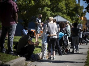 Long lines stretched around the building, mostly parents with children, at the COVID-19 testing clinic that opened at McNabb Arena, September 19, 2021.