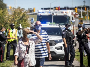 OTTAWA -- September 19, 2021 --Emergency officials were on the scene of an apparent LRT derailment near Tremblay station, Sunday, September 19, 2021. People that were on the train stood near the scene. ASHLEY FRASER, POSTMEDIA