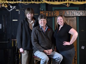 Rainbow Bistro's Danny Sivyer, centre, and his children Stacie and Jesse, left, celebrate the pub and live music venue's 30th anniversary in Ottawa on Tuesday, November 11, 2014.