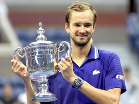 Daniil Medvedev of Russia celebrates with the championship trophy after defeating Novak Djokovic of Serbia to win the Men's Singles final match on Day Fourteen of the 2021 US Open at the USTA Billie Jean King National Tennis Center on September 12, 2021 in the Flushing neighborhood of the Queens borough of New York City.