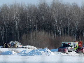 A file photo shows emergency vehicles at the scene of the fatal plane crash near the Carp airport on Feb. 10.