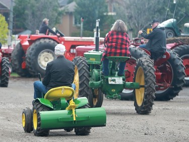 Doug Nesbitt didn't have any tractor envy as he rode his tiny 1966 model during the antique tractor show.