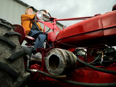 Jill Campbell-Birch drives a 1954 Super H during the antique tractor show around the fair early in the afternoon.