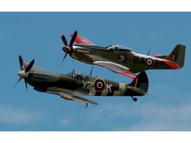 A Spitfire and a P-51 Mustang stay in tight formation at the Gatineau Airshow on Sunday.