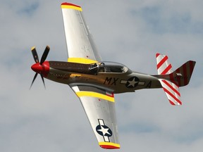A P-51 Mustang flies about the crowd at the Gatineau Airshow on Sunday.