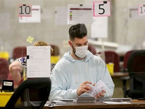 Special ballots from national and international Canadian Forces and incarcerated electors were being counted in the "counting cage" at Elections Canada Distribution Centre Monday evening.