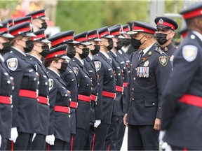 Chief Peter Sloly inspects the new officers of the Ottawa Police Service during the formal badge ceremony held at Lansdowne Park on Wednesday.