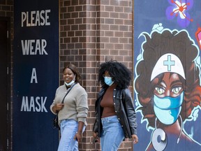 Files:  People reminded to wear  masks along Rideau Street on a beautiful fall day.