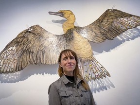 Ceramic artist Lisa Creskey poses with one of her works at LA Pai Gallery. Creskey will talking part in Saturday's Artwalk.