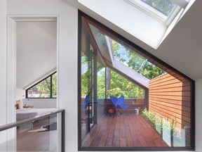 5. Half of the master bedroom at Skygarden House is given over to an intimate exterior space clad in warm ash planks.