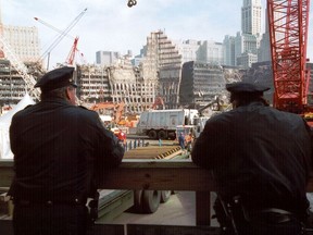 Police officers survey the site of the World Trade Centre in November, 2001, two months after the 9/11 attacks.