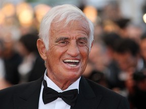 In this file photograph taken on May 17, 2011, French actor Jean-Paul Belmondo poses on the red carpet before a ceremony in his honor and the screening of "The Beaver" presented out of competiton at the 64th Cannes Film Festival in Cannes, southern France.