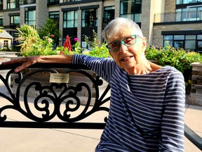 Denise Scrim, V!VA Barrhaven’s first-ever resident, takes a break on the bench named in her honour.  SUPPLIED PHOTOS