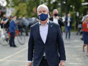 Conservative Party Leader Erin O'Toole walks back to his bus after a campaign event in Russell, Ont., on September 14, 2021.