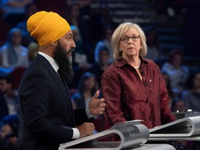 NDP leader Jagmeet Singh (L) and then-Green Party leader Elizabeth May take part in the federal leaders French language debate in 2019. There are two official debates this week for Election 2021.