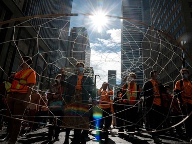 People hold a giant dreamcatcher during the "Every Child Matters" march to mark the first National Day for Truth and Reconciliation in Montreal on Thursday.