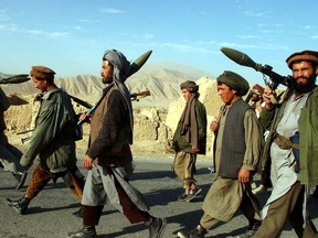 Fall, 2001: Fighters with the Northern Alliance head towards Kunduz, Afghanistan.