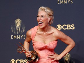 Hannah Waddingham laughs as she poses with her award for outstanding supporting actress in a comedy series, for "Ted Lasso", at the 73rd Primetime Emmy Awards in Los Angeles, U.S., September 19, 2021.