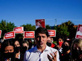 Canada's Liberal Prime Minister Justin Trudeau speaks to reporters at an election campaign stop on the last campaign day before the election, in Montreal, Quebec, Canada September 19, 2021.