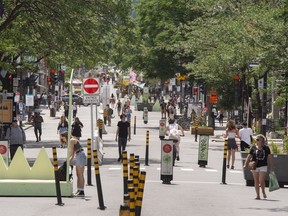 Montrealers take advantage of the summer weather on a pedestrian mall in July.