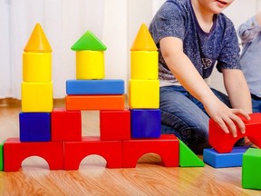 A child playing with building blocks.