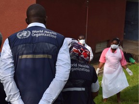 Files: World Health Organization (WHO) officials talk to  medical staff as they inspect ebola preparedness facilities at a hospital near the border with the Democratic Republic of Congo in Bwera, Uganda, June 12, 2019.