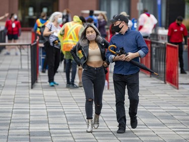 Facemasks and umbrellas were needed at Lansdowne Park for RBC Bluesfest on Thursday, Sep. 23, 2021.