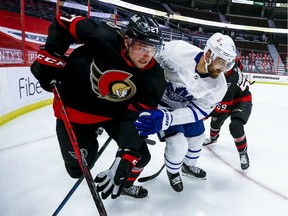 Ottawa Senators centre Logan Brown and Toronto Maple Leafs left wing Nick Foligno fight for position, May 12, 2021.