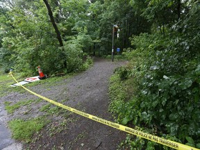 Police crime-scene tape cordons off a section of Elmhurst Park in this file photo from July 2017.